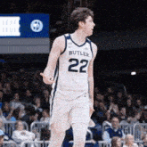 a basketball player wearing a butler jersey number 22