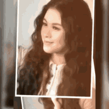 a picture of a woman with long hair is being displayed
