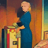 a woman in a blue dress is standing next to a box