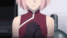 a close up of a girl with pink hair wearing a red dress and gloves .