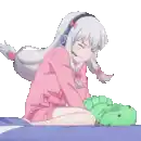 a girl in a pink shirt is sitting on a bed holding a stuffed animal .