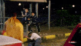 a blurred image of a bus stop with the word bulu on the bottom left