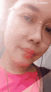 a close up of a woman wearing glasses and earphones
