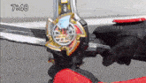 a person is holding a toy sword with the time 7:48 on the bottom