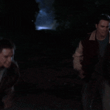a man in a varsity jacket has the letter e on his sleeve