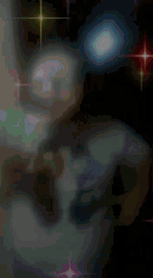 a blurry picture of a person 's face with a blue shirt on