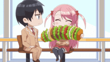 a boy and a girl are sitting on a bench and the girl is eating a large sandwich