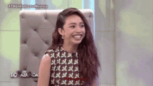 a woman sitting in a chair with the words tonight on boy abunda on the bottom
