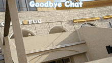 a building with a sign that says goodbye chat on it