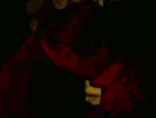 a man and a woman kissing in a dark room