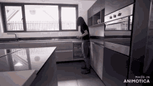a woman in a kitchen with the words made in animotica on the bottom right