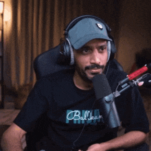 a man wearing headphones and a black shirt that says bulleany