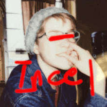 a person wearing glasses and a beanie has the word incel written on their face