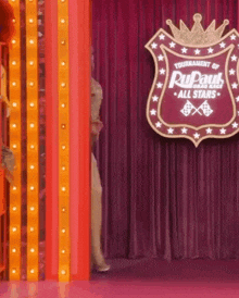 a sign that says tournament of rupaul all stars on it