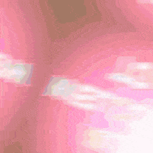 a pink and white background with a blurred image of a person 's face