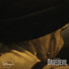 a close up of a person 's face with daredevil born again written on the bottom