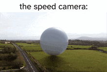 a picture of a ball in a field with the words the speed camera