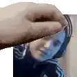 a hand is holding a piece of paper over a girl 's face .
