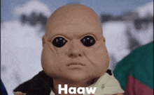 a close up of a baby 's face with haaw written on the bottom