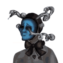 a drawing of a person with a blue face and snakes on their head