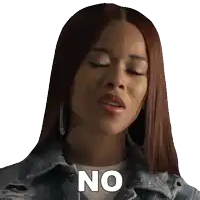 a woman wearing a denim jacket and earrings says no