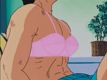 a man wearing a pink bra on his head
