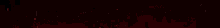 a red light is shining on a black background with the letter b in the middle .