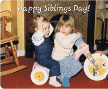 a happy siblings day greeting card with two children on a tricycle