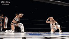 two women in a wrestling ring with the word stardom on the bottom right