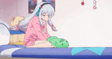 a girl with headphones is sitting on a bed with a stuffed animal and a poster that says aoi