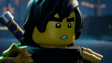 a close up of a lego figure with a sword