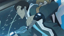 a man in a cartoon is holding a sword and looking at a screen .