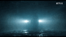 a car 's headlights are shining in the dark .