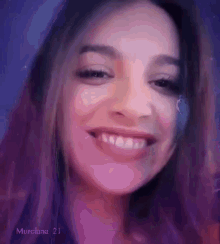 a close up of a woman 's face with the name murciana 21 on the bottom left