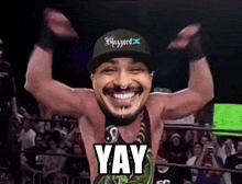 a man wearing a hat that says blizzard on it is smiling and saying yay