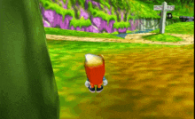 a video game character is standing in a field with a sign that says ' a ' on it