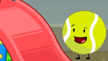 a tennis ball with a smile on its face is standing next to an orange ball on a slide