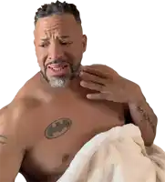 a man with a batman tattoo on his chest