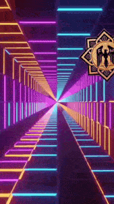 it looks like a tunnel with neon lights going through it and a logo in the middle .