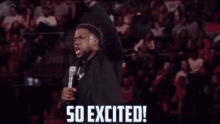 a man holding a microphone in front of a crowd with the words so excited