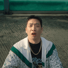 a man wearing a gucci jacket and a shirt that says drayz
