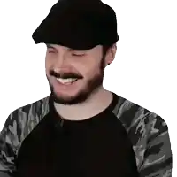 a man with a beard wearing a black hat and a camouflage shirt