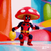 a toy deadpool with a mushroom hat is giving a thumbs up