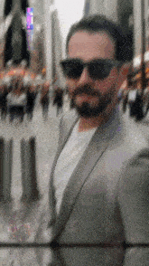 a blurry photo of a man wearing sunglasses