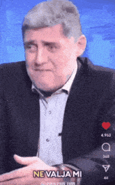 a man in a suit says ne valja mi on the screen