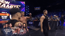 a group of men are standing in front of a sign that says aew dynamite