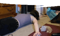 a person laying on the floor with the letter o on the floor in front of them