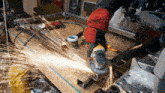 a person is using a grinder on a piece of metal and sparks are flying