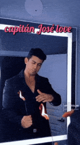a man in front of a mirror with the words capitan jose love above him