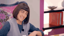 a woman wearing a wig and a name tag that says ' amanda '